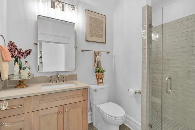 a bedroom with a bed lamp and furniture