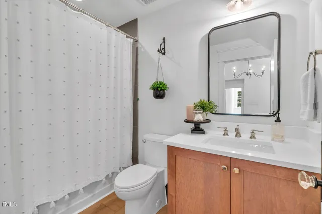 a living room with furniture and large windows