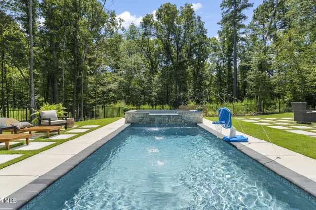 a view of a swimming pool with a lounge chair