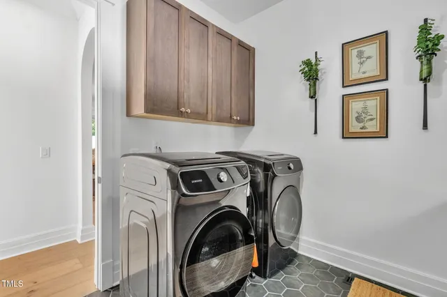 a terrace of a house with wooden floor and outdoor seating