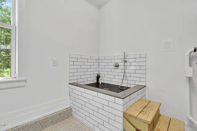 an aerial view of a house with swimming pool