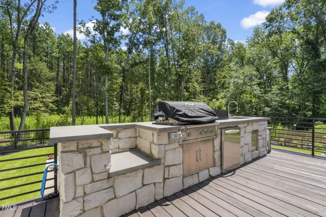 a view of a back yard of a house with a garden