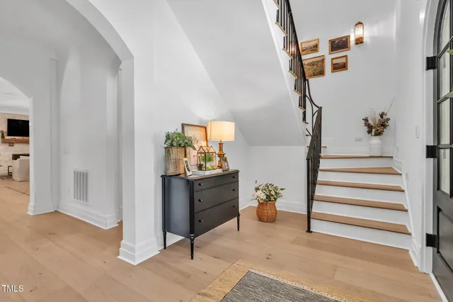 a living room with furniture fireplace and window