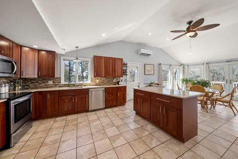 a large kitchen with stainless steel appliances lots of counter top space