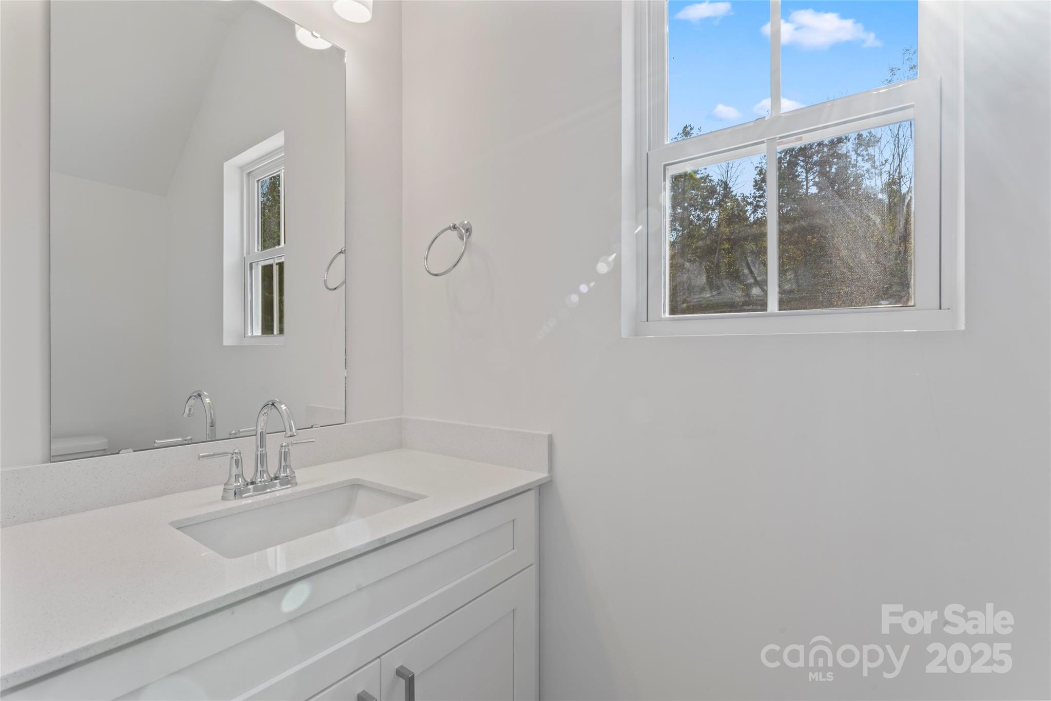 757 Mockingbird Road, Unit 4 Albemarle, NC 28001 - Photo 11 of 36 a bathroom with a sink and a mirror