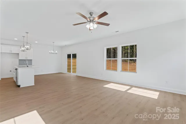 a kitchen that has a lot of cabinets in it