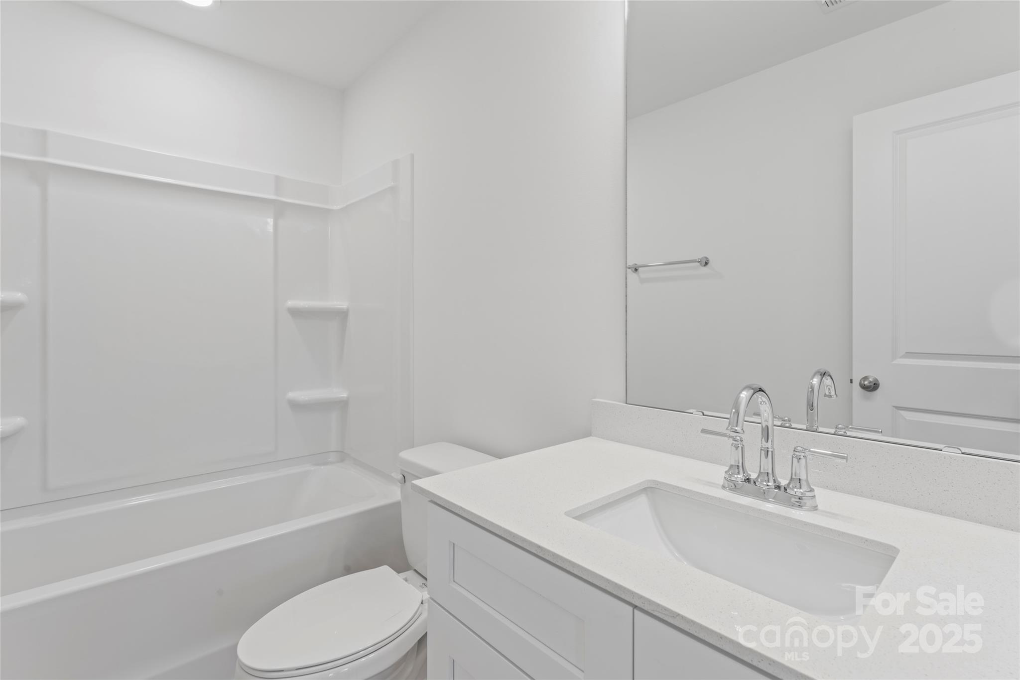 757 Mockingbird Road, Unit 4 Albemarle, NC 28001 - Photo 32 of 36 a bathroom with a sink toilet and bathtub