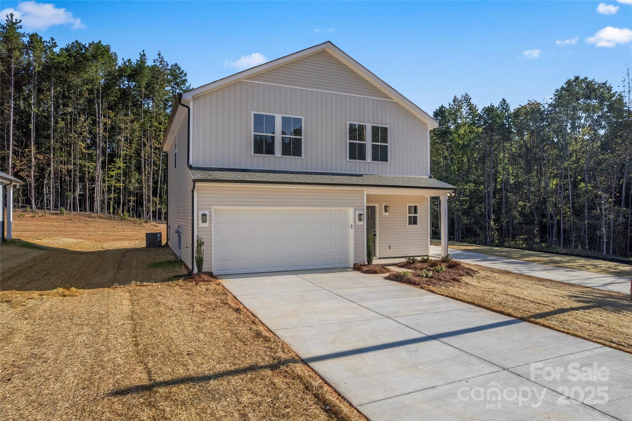 757 Mockingbird Road, Unit 4 Albemarle, NC 28001 - Photo 6 of 36 a front view of a house with a yard and trees