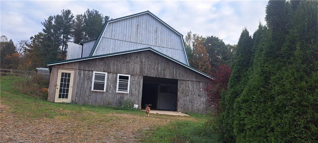 252 Rock Run Road Punxsutawney, PA 15767 - Photo 15 of 15 a backyard of a house with plants and large tree