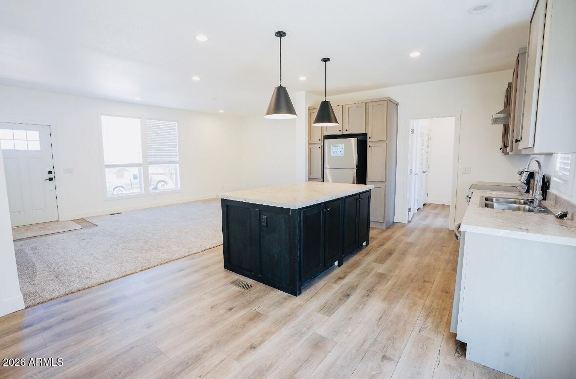 4710 Lazy Lariat Lane Rimrock, AZ 86335 - Photo 8 of 19 a kitchen with a refrigerator and a sink
