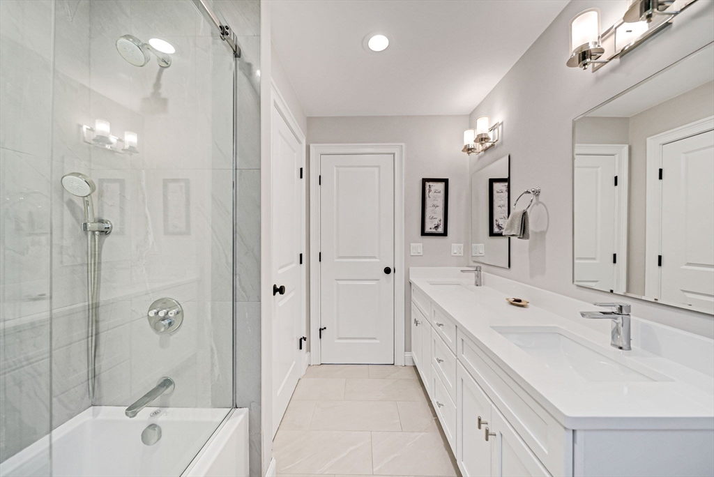 17 Sunrise Terrace Needham, MA 02492 - Photo 25 of 42 a spacious bathroom with a double vanity sink mirror double and bathtub