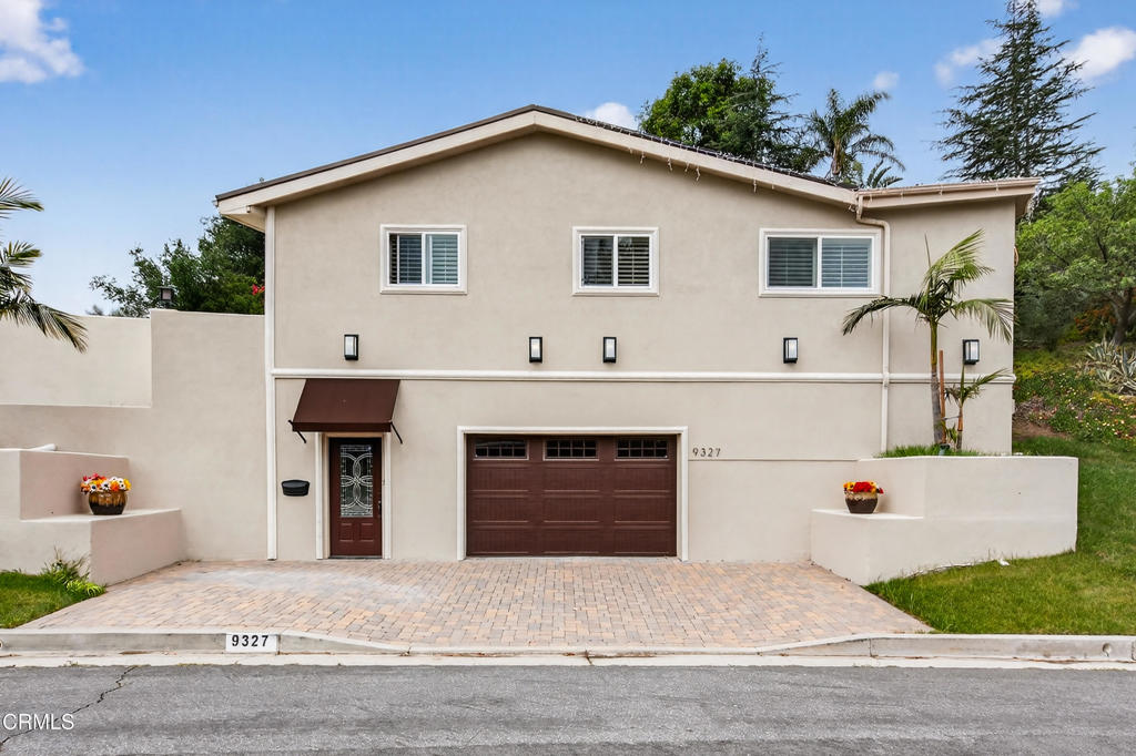 9325 La Shell Drive Tujunga, CA 91042 - Photo 31 of 46 a white building that has a sign on it