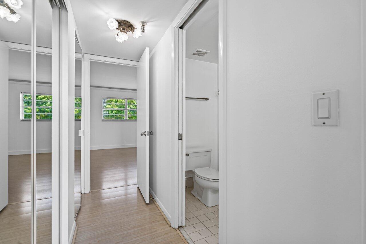 198 Northwest 67th Street, Unit 403 Boca Raton, FL 33487 - Photo 19 of 32 Hallway between Jack & Jill w/ Closets