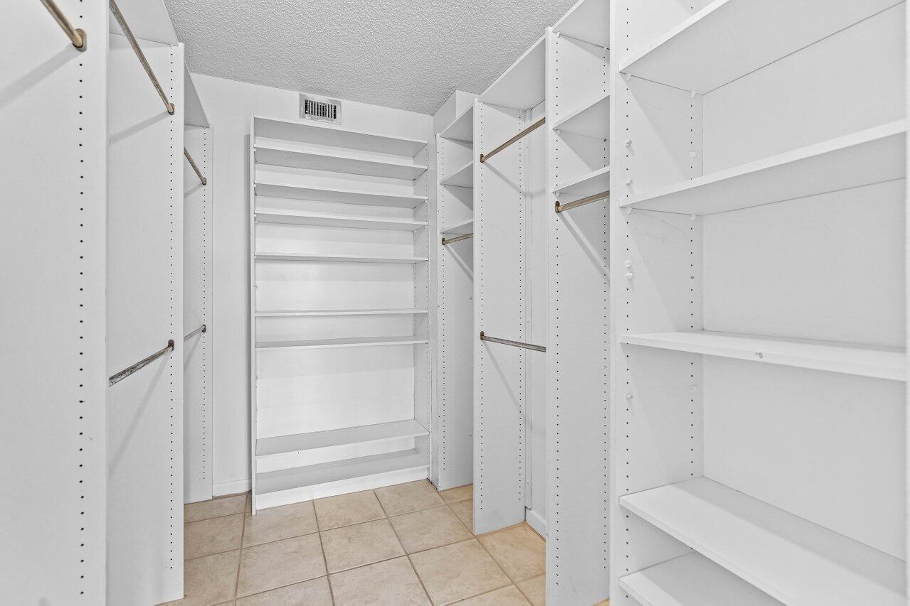 198 Northwest 67th Street, Unit 403 Boca Raton, FL 33487 - Photo 26 of 32 Primary Closet