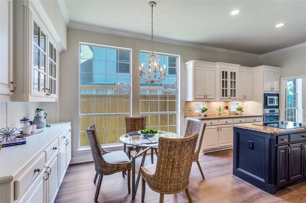 4015 Stonehollow Way Dallas, TX 75287 - Photo 13 of 26 a view of a dining room with furniture window and wooden floor