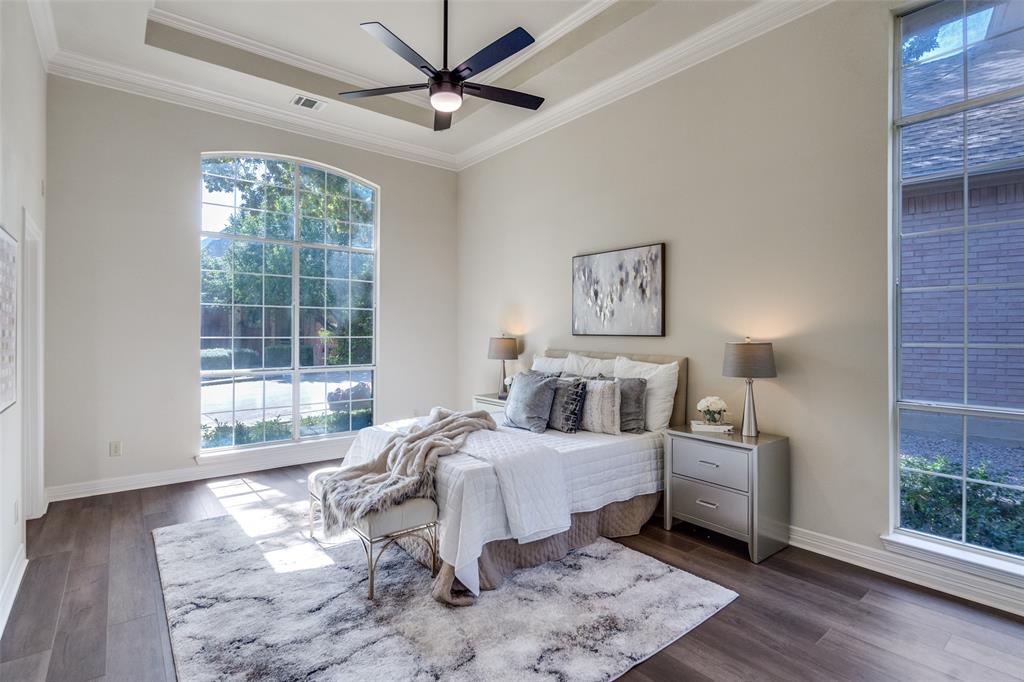 4015 Stonehollow Way Dallas, TX 75287 - Photo 14 of 26 a bedroom with a large bed and a window