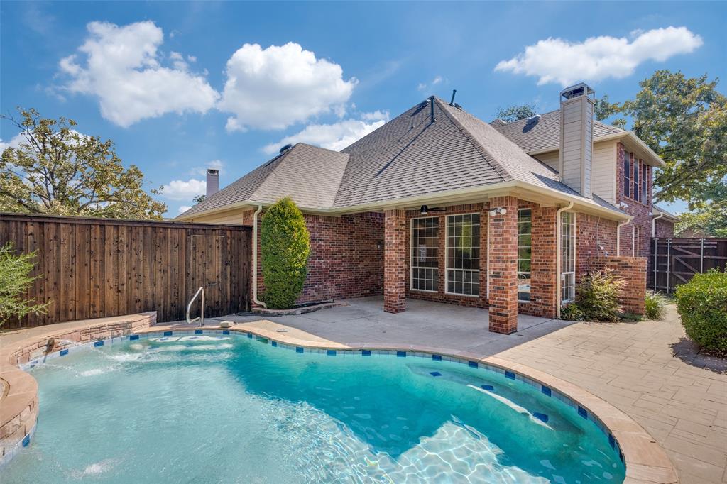 4015 Stonehollow Way Dallas, TX 75287 - Photo 24 of 26 a front view of a house with garden