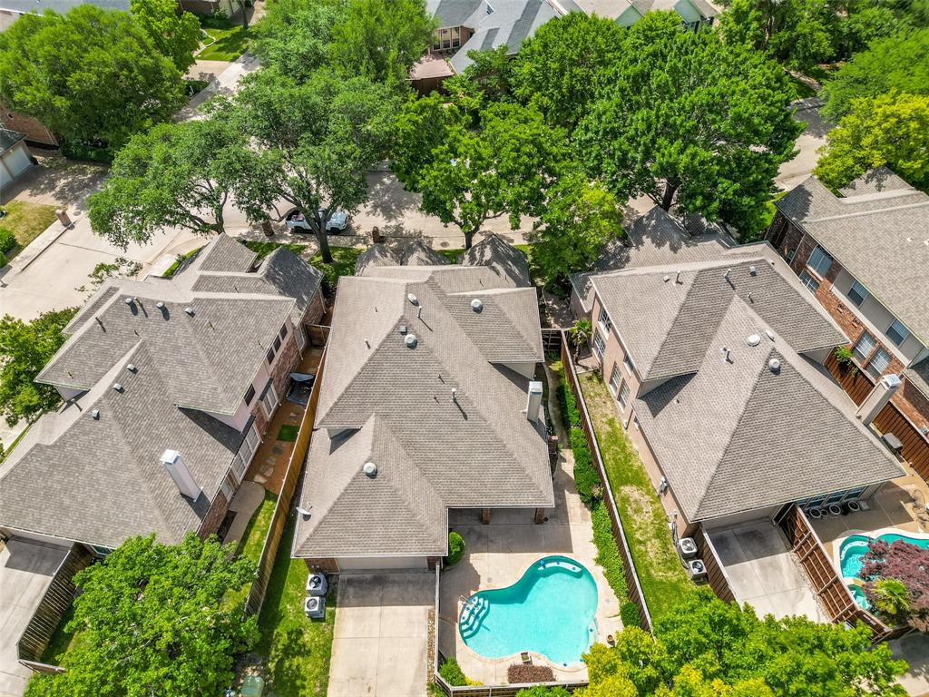 4015 Stonehollow Way Dallas, TX 75287 - Photo 25 of 26 an aerial view of a house with a yard and trees