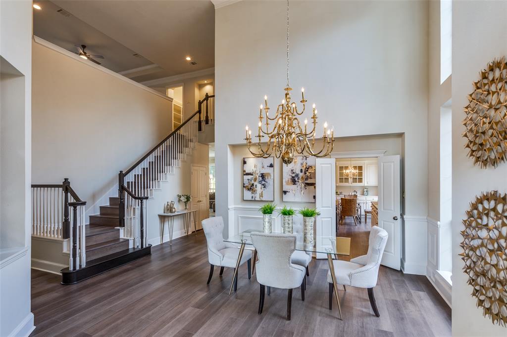 4015 Stonehollow Way Dallas, TX 75287 - Photo 4 of 26 a view of a dining room with furniture and wooden floor