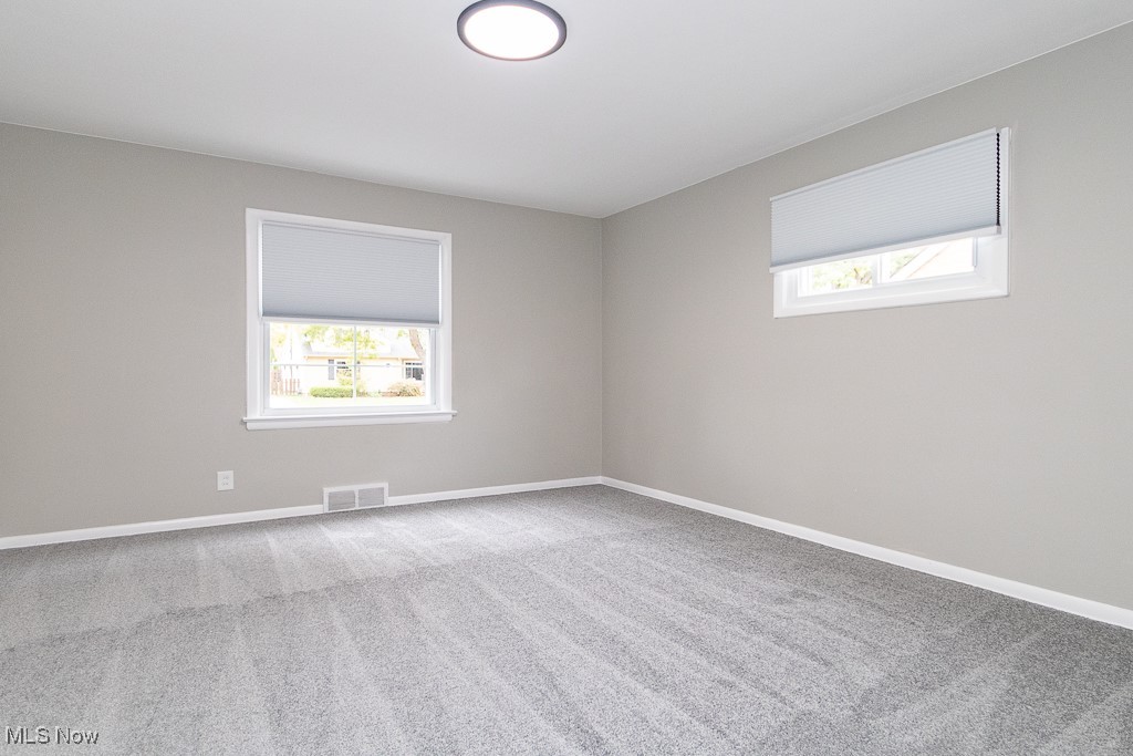 5683 Cherokee Road Cleveland, OH 44124 - Photo 12 of 35 Unfurnished room featuring light carpet
