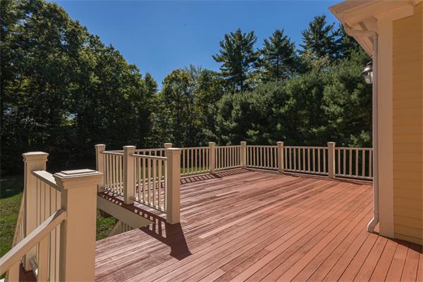108 Deerfield Lane Hanover, MA 02339 - Photo 26 of 28 a balcony with wooden floor and fence