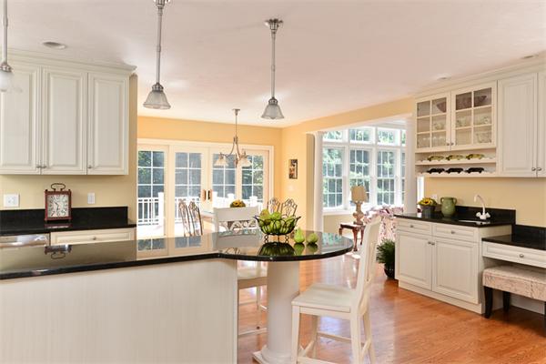 108 Deerfield Lane Hanover, MA 02339 - Photo 4 of 28 a kitchen with sink a stove and cabinets