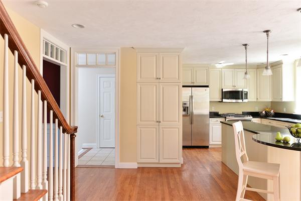 108 Deerfield Lane Hanover, MA 02339 - Photo 8 of 28 a kitchen with stainless steel appliances granite countertop a refrigerator and a stove top oven
