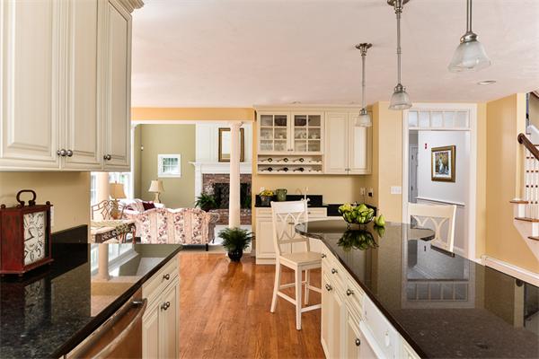 108 Deerfield Lane Hanover, MA 02339 - Photo 9 of 28 a view of a kitchen with kitchen island granite countertop a large window cabinets and stainless steel appliances