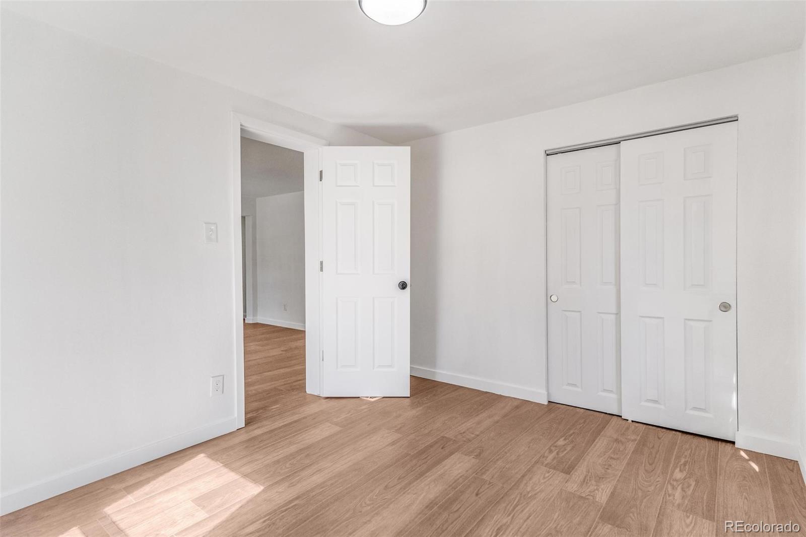 350 South Elbert Street Elizabeth, CO 80107 - Photo 12 of 22 a view of an empty room with wooden floor