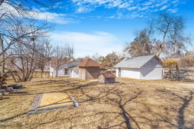 a view of a house with a snow in the yard