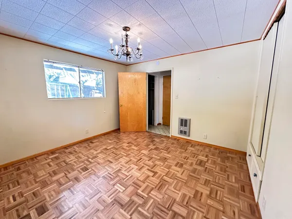 a view of a bedroom with a chandelier