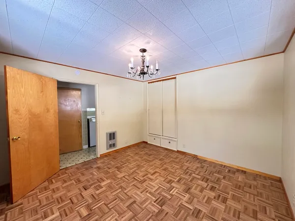 a view of a chandelier fan and closet