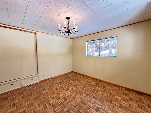 a view of a livingroom with a chandelier fan