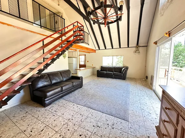 a living room with furniture and a rug