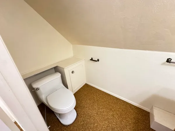 a bathroom with a toilet and a sink