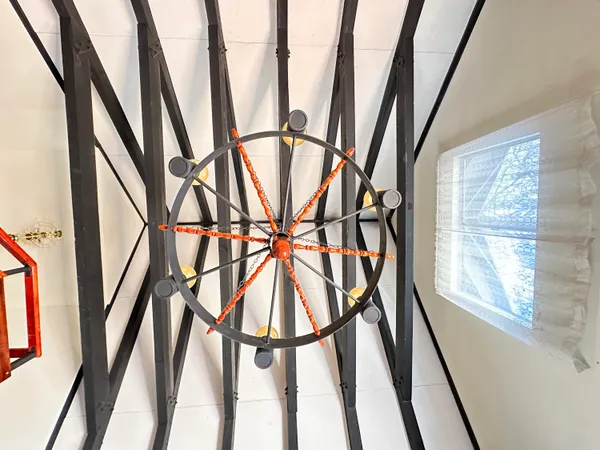 a very nice looking room with a glass door and wooden floor