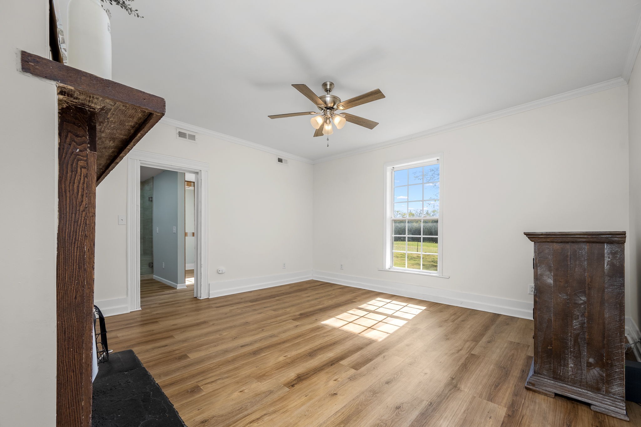 2180 Polly Adams Road Petersburg, TN 37144 - Photo 13 of 57 a view of empty room with wooden floor and fan