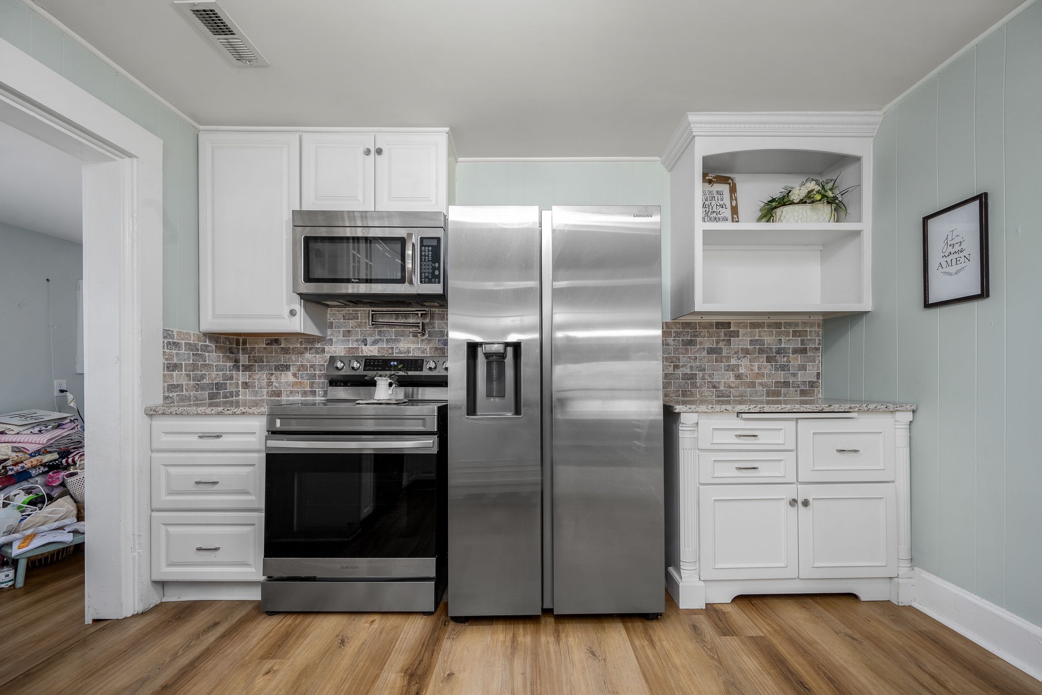 2180 Polly Adams Road Petersburg, TN 37144 - Photo 25 of 57 a kitchen with stainless steel appliances granite countertop a refrigerator and a stove top oven