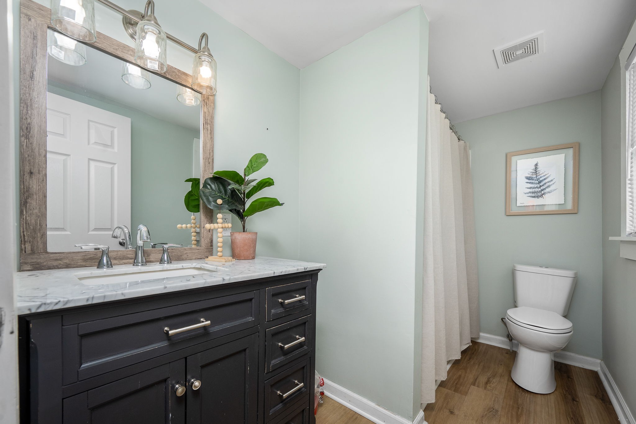 2180 Polly Adams Road Petersburg, TN 37144 - Photo 27 of 57 a bathroom with a granite countertop sink a toilet and a mirror