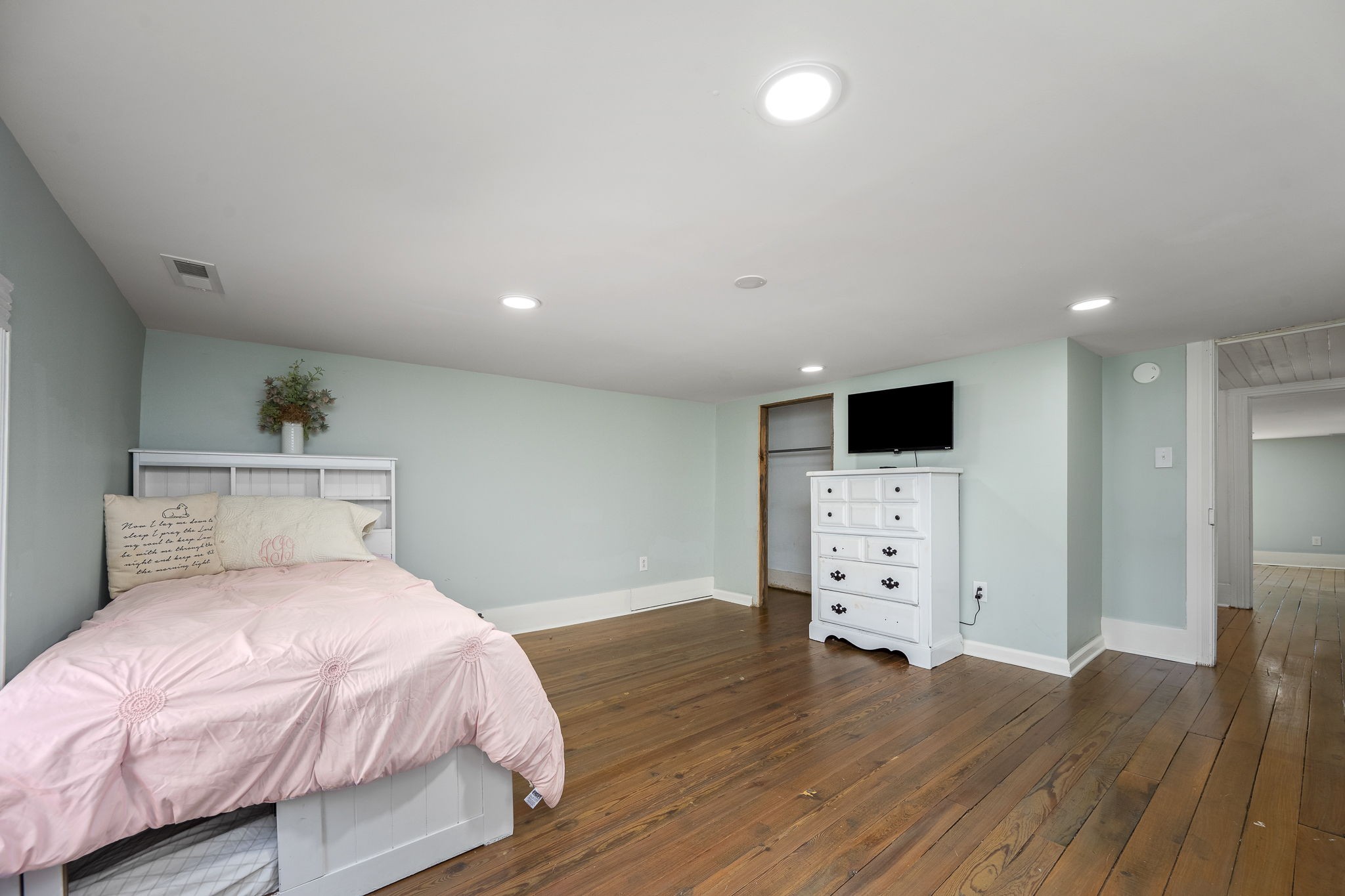 2180 Polly Adams Road Petersburg, TN 37144 - Photo 32 of 57 a bedroom with a bed and wooden floor