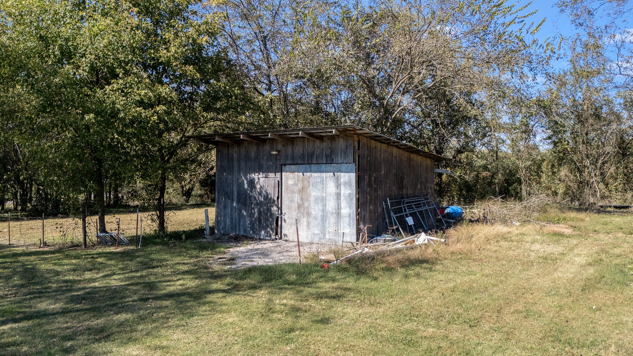 2180 Polly Adams Road Petersburg, TN 37144 - Photo 54 of 57 a view of a backyard with a tree and wooden fence