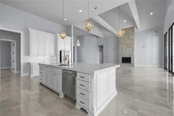 a kitchen with cabinets and window