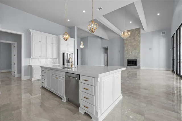 a kitchen with cabinets and window