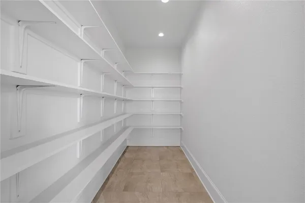 a view of room with wooden floor