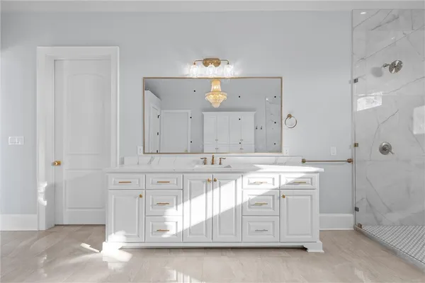 a bathroom with a bathtub and shower