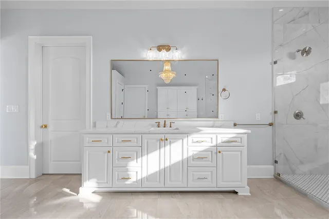 a bathroom with a bathtub and shower