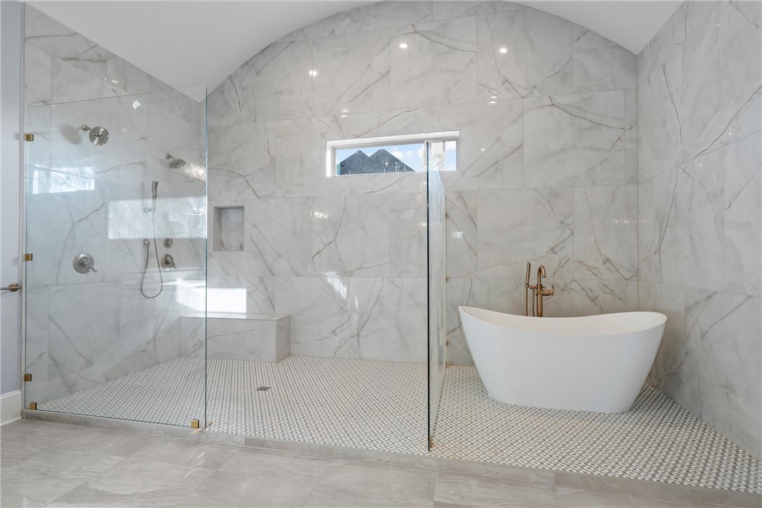 129 Iris Street Lorena, TX 76655 - Photo 45 of 56 a bathroom with a bathtub and shower