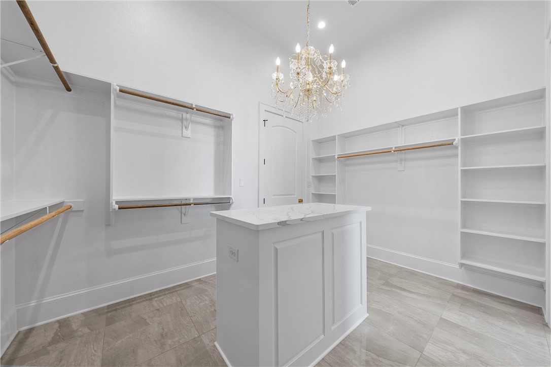 129 Iris Street Lorena, TX 76655 - Photo 46 of 56 a view of an empty room with a chandelier