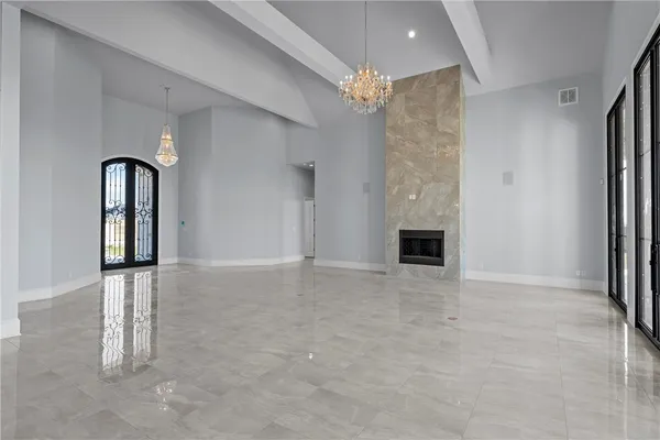 a view of an empty room with a fireplace