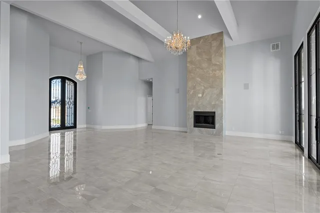 a view of an empty room with a fireplace